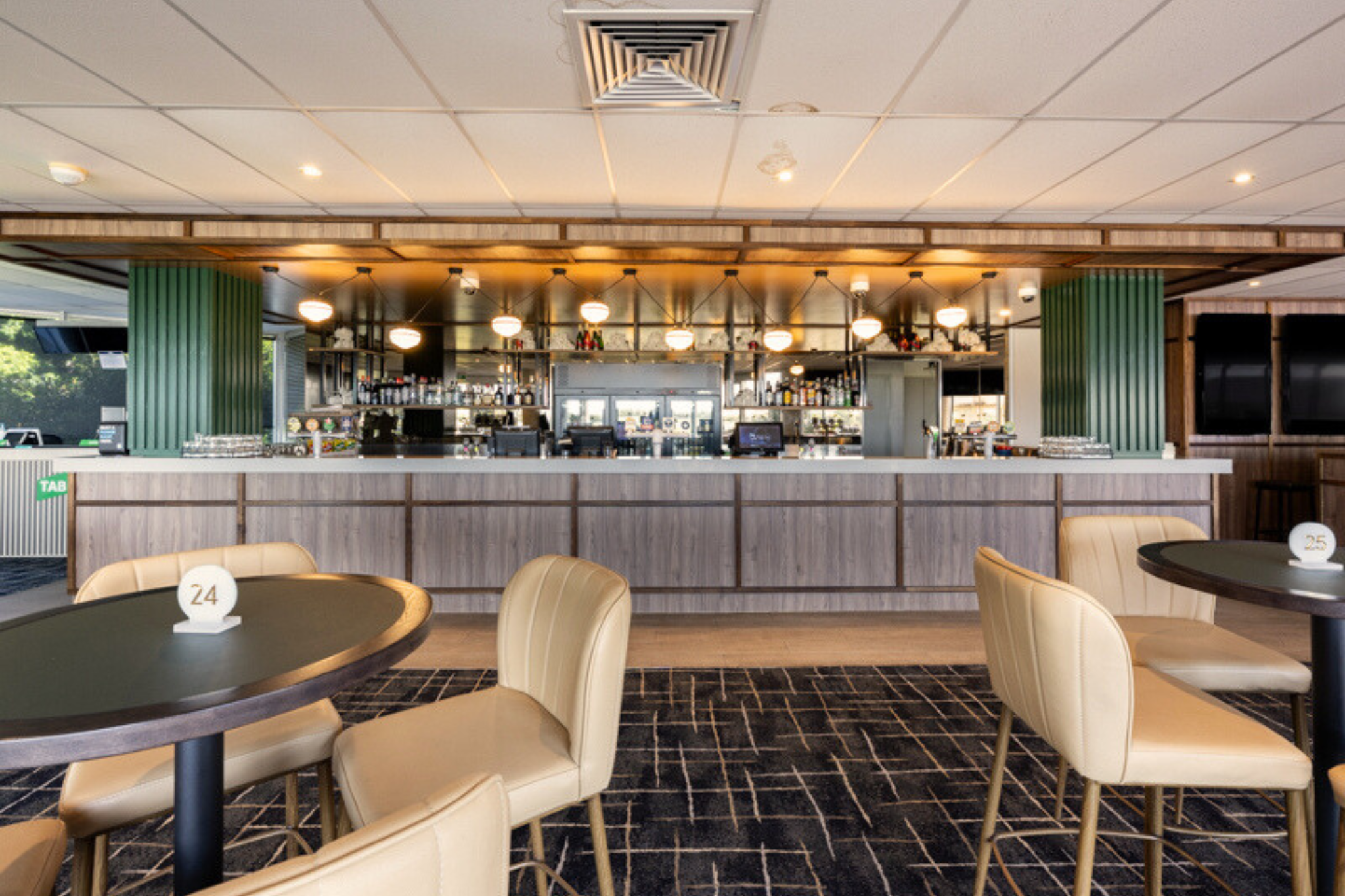 Members Bar & Bistro area at the Sunshine Coast Turf Club. Modern vintage style bar with dry bar tables.